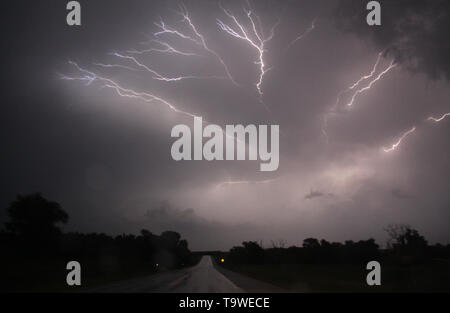 Lightning strikes at night from huge squall line covering 6 states areas in the Oklahoma City as flooding rain and severe storms, including tornadoes, are predicted in the Southern Plains through late Monday May 20, 2019. Tornado watches in effect in the Texas Panhandle and Oklahoma expire before midnight. Then, flooding is expected to become the major concern overnight from Oklahoma City to Tulsa and to the northeast. The tornado outbreak has not been as severe as feared as twisters have mostly avoided population centers. Photo by Gene Blevins/ZumaPress (Credit Image: © Gene Blevins/ Stock Photo