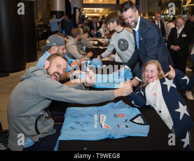 Sydney, Australia. 20th May, 2019. Sydney FC players sign for fans as the team celebrates with supporters in Sydney, Australia, May 20, 2019. Credit: Zhu Hongye/Xinhua/Alamy Live News Stock Photo