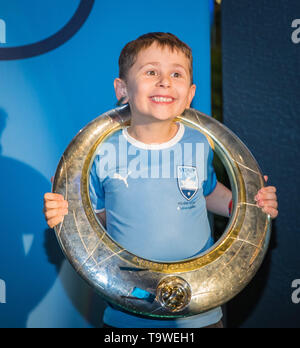 Sydney, Australia. 20th May, 2019. Sydney FC little fan takes photos with the A-League Grand Final trophy as the team celebrates with supporters in Sydney, Australia, May 20, 2019. Credit: Zhu Hongye/Xinhua/Alamy Live News Stock Photo