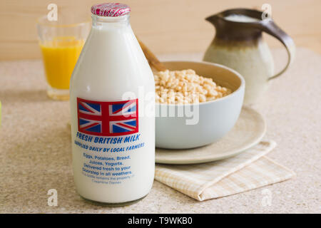 Fresh semi skimmed milk in a recyclable glass bottle delivered to the door step by a traditional milk man Stock Photo