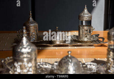 Turkish coffee with traditional embossed metal tray and cup
