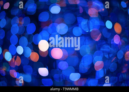 Abstract blurred background with numerous colourful bright festive bokeh. Texture with copy space for text. Celebration, holidays concept. Horizontal Stock Photo