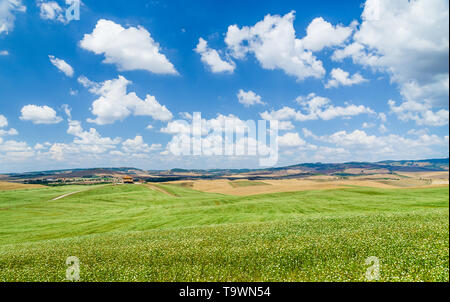 Scenic Tuscany landscape with rolling hills and beautiful cloudscape in Val d'Orcia, Italy Stock Photo