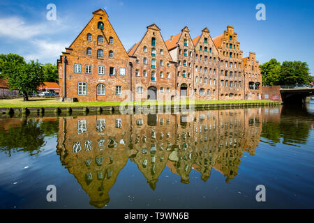 Beautiful view of famous historic Salzspeicher brick storehouse buildings on the Upper Trave River in central Luebeck on a scenic sunny day in summer, Stock Photo