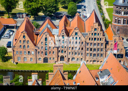 Beautiful view of famous historic Salzspeicher brick storehouse buildings on the Upper Trave River in central Luebeck on a scenic sunny day in summer, Stock Photo