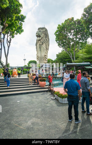 Singapore - January 2019: Merlion Statue on Sentosa Island and tourists in Singapore. Merlion is Singapore's famous landmark Stock Photo