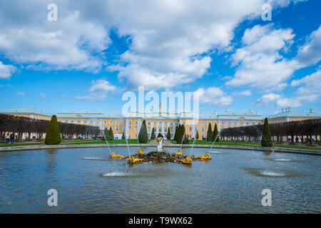 Saint Petersburg, Russia - May 2019: Peterhof fountains and palace view and tourists visiting. The Peterhof Palace is a popular spot for sightseeing. Stock Photo