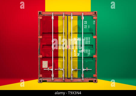 The concept of  Guinea export-import, container transporting and national delivery of goods. The transporting container with the national flag of Guin Stock Photo
