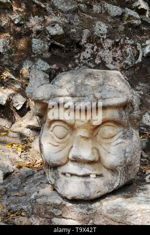 Copan Honduras - ancient Mayan archaeology site  - sculpture of Old Man's Head; Copan maya site, Honduras Central America Stock Photo