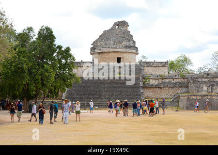 Tourists looking at The Observatory, also known as El Caracol, Chichen Itza Mexico; mayan ruins, UNESCO world heritage site, Yucatan, Mexico Stock Photo