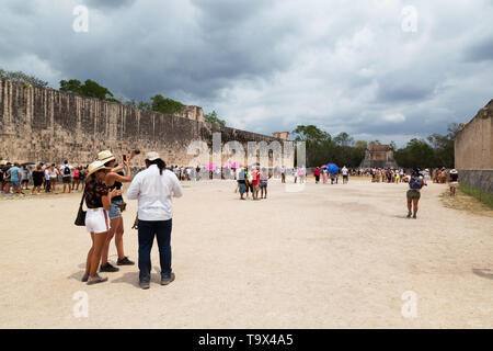 Tourists at Chichen Itza Ball court, or Ball game - the largest in the Maya world; Chichen Itza mayan ruins, Yucatan Mexico Latin America Stock Photo