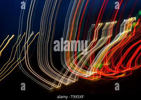 Laser colorful light effect over a plain black background Stock Photo