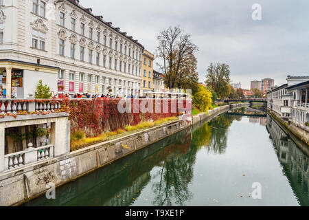 Ljubljana, Slovenia - October 26, 2018: View of Ljubljanica river and Butchers' bridge or Mesarski most in Ljubljana Stock Photo