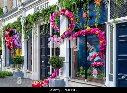 Floral display outside Hackett shop in Sloane Street for Chelsea in Bloom 2019. Chelsea, London, England Stock Photo