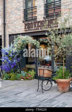 Floral display outside The Provenance village butcher shop in Pavilion Road for Chelsea in Bloom 2019. Chelsea, London, England Stock Photo