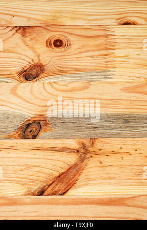 Rustic pine wood plank floorboard with knots as background Stock Photo