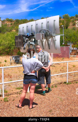 Visitors taking an interest in Concentrated Solar Power mirror technology at Bisosphere 2, the American Earth system science research facility located Stock Photo