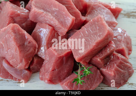 Fresh veal isolated on a white background.Raw veal cut into pieces Stock Photo