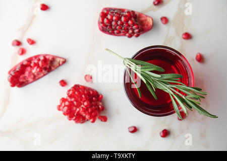 Glass of tasty pomegranate juice on table Stock Photo