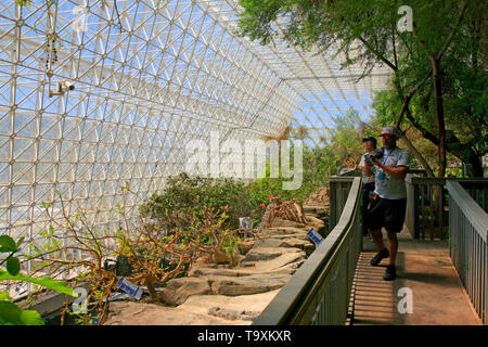 People taking photos inside the Rainforest and Ocean area at Bisosphere 2, the American Earth system science research facility located in Oracle, AZ Stock Photo