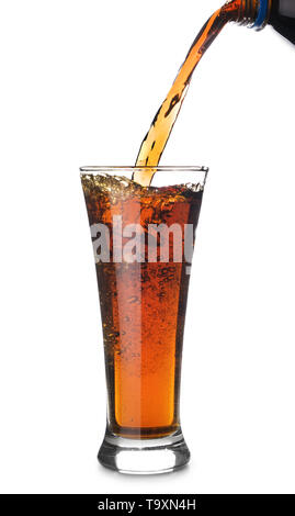 Pouring of tasty soda into glass on white background Stock Photo