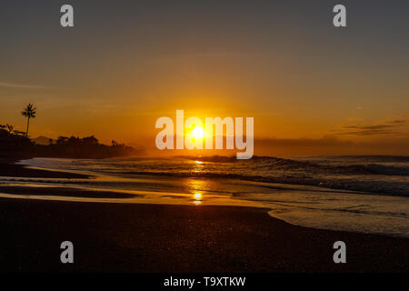 Sunrise over the ocean at Keramas Beach (Pantai Keramas), Gyaniar, Bali ...