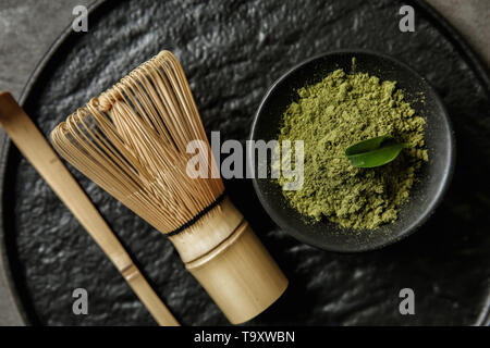 Composition with powdered matcha tea on tray Stock Photo