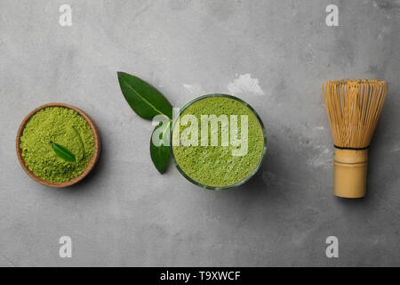 Composition with matcha tea on grey background Stock Photo