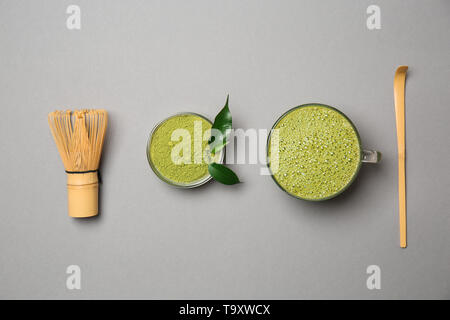 Composition with matcha tea on grey background Stock Photo