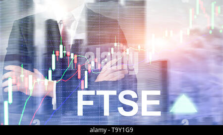 FTSE 100 Financial Times Stock Exchange Index United Kingdom UK England Investment Trading concept with chart and graphs. Stock Photo