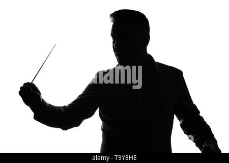 Silhouette of male orchestral conductor on white background Stock Photo