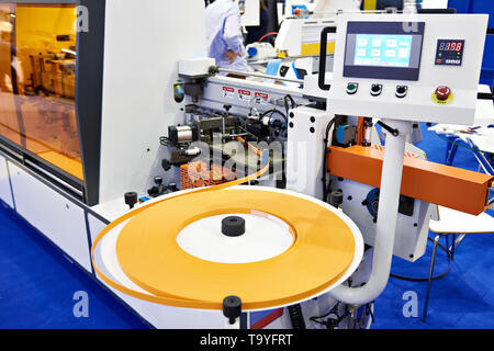 Single sided automatic edge banders on factory Stock Photo