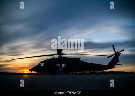 A HH-60M Blackhawk medevac helicopter waits on the tarmac, ready to launch at a moments notice, if the call for medical air support comes during Exercise Maple Resolve 19-01 located in Wainwright, AB,  Canada. Maple Resolve is an annual brigade-level validation exercise for the Canadian Army's High Readiness Brigade and is designed to foster partnership among allied forces. Stock Photo