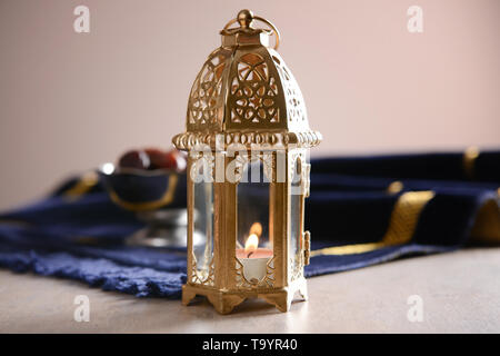 Muslim lamp as Ramadan symbol on table Stock Photo