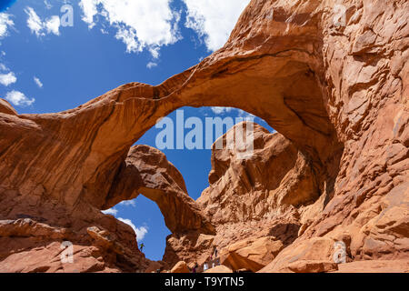 arch of rock with blue sky in the background Stock Photo