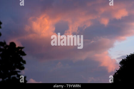 dark clouds in sunset light Stock Photo