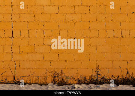 orange plaster rough brick outside wall texture Stock Photo
