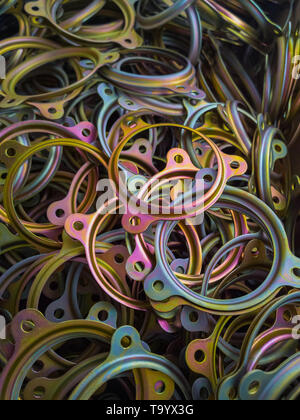 cadmuim with chromatization yellow protective coating stamped steel parts. Stock Photo