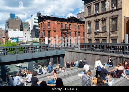 People relaxing at the high line, urban park redeveloped from an abandoned elevated rail line in Chelsea, Manhattan New york city, NY / USA Stock Photo