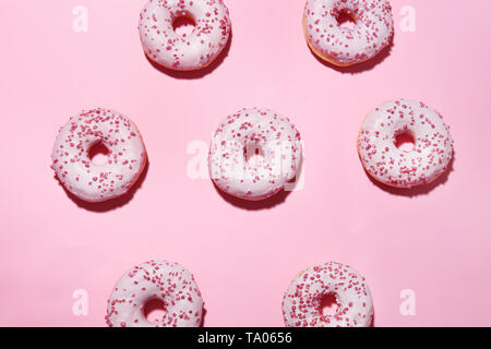 Many tasty doughnuts on color background Stock Photo
