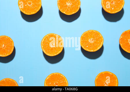 Many pieces of orange on color background Stock Photo