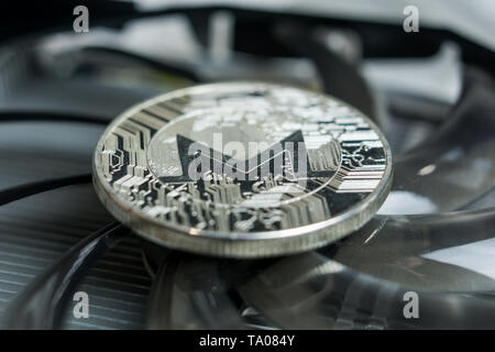 Monero cryptocurreny coin placed on GPU graphic card Stock Photo