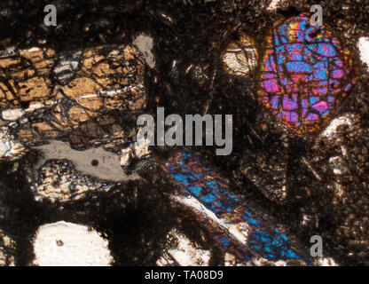 Polarized photomicrograph, diverse minerals in volcanic dust, Mount Fuji, Japan, Stock Photo