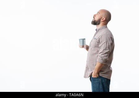 Handsome man with blue glasses drinking coffee Stock Photo