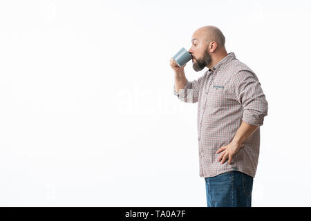 Handsome man with blue glasses drinking coffee Stock Photo