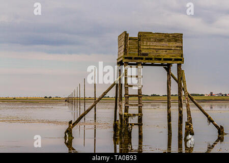 A refuge box for walkers caught out by the tide on the Pilgrims' Way, Holy Island of Lindisfarne, Northumberland, UK. July 2018. Stock Photo