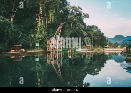 hidden blue lagoon lake near mountain in Vang Vieng, Laos. Clear clear water in the lagoon. Stock Photo