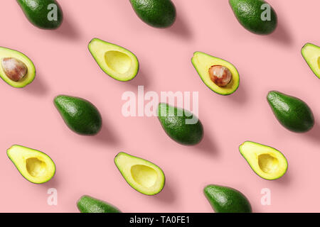 Avocado colorful pattern on a pastel pink background. Summer concept Stock Photo
