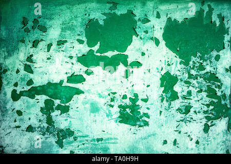 Background from green metal door with paint peeling off from old age Stock Photo