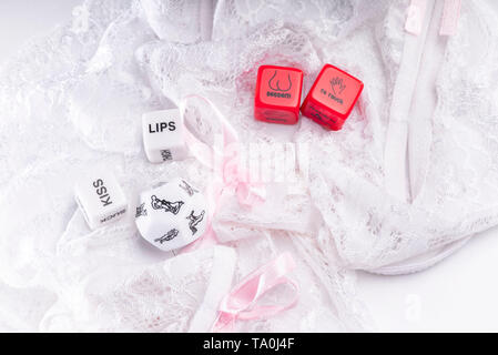 Cube with sexy poses, Kama Sutra. Toys for adults. Sex toys. Cubes with  Kama Sutra poses for sex games. Playing cubes of red and white color for  sexua Stock Photo - Alamy